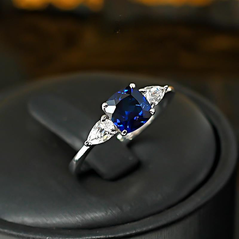 Three Stone Blue Cushion Cut Sterling Silver Ring