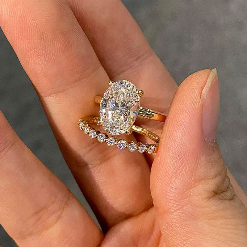 Classic Oval Cut Sterling Silver Bridal Set With Round Cut Band