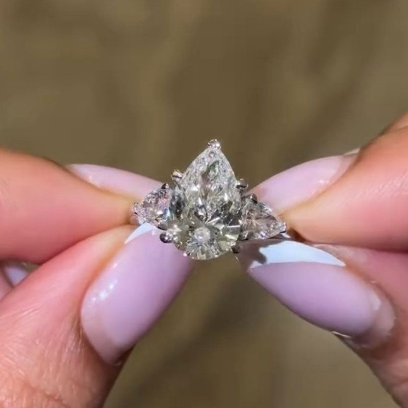Luxurious Pear Cut Three Stone Sterling Silver Engagement Ring