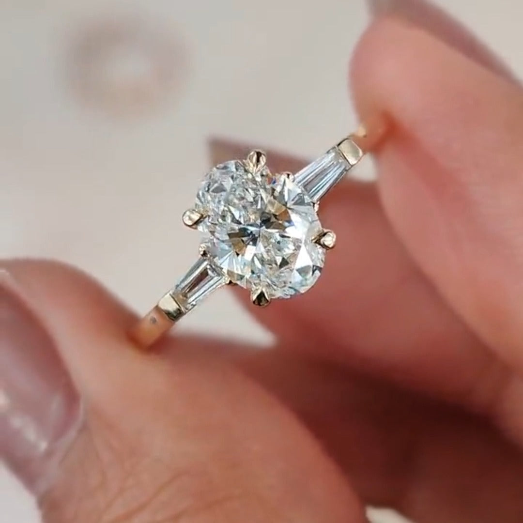 Three Stone Oval Cut with Side Tapered Baguette Cut Engagement Ring
