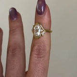 Elegant Oval Cut Gold Tone Sterling Silver Ring with Side Accents