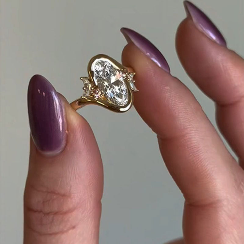 Elegant Oval Cut Gold Tone Sterling Silver Ring with Side Accents