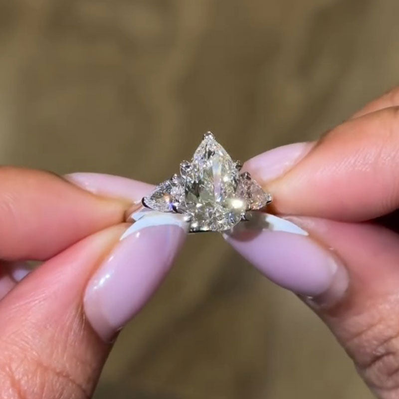 Luxurious Pear Cut Three Stone Sterling Silver Engagement Ring