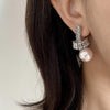 Elegant Pearl Drop Earrings with Baguette Stone Accents