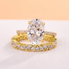 Golden Tone Oval Cut Sterling Silver Bridal Set with Exquisite Marquise & Round Cut Band