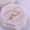 Rose Golden Halo Oval Cut Twist Engagement Ring