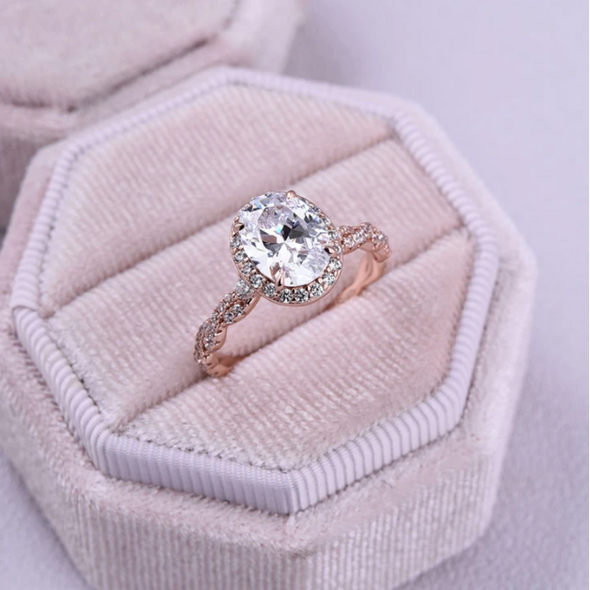 Rose Golden Halo Oval Cut Twist Engagement Ring