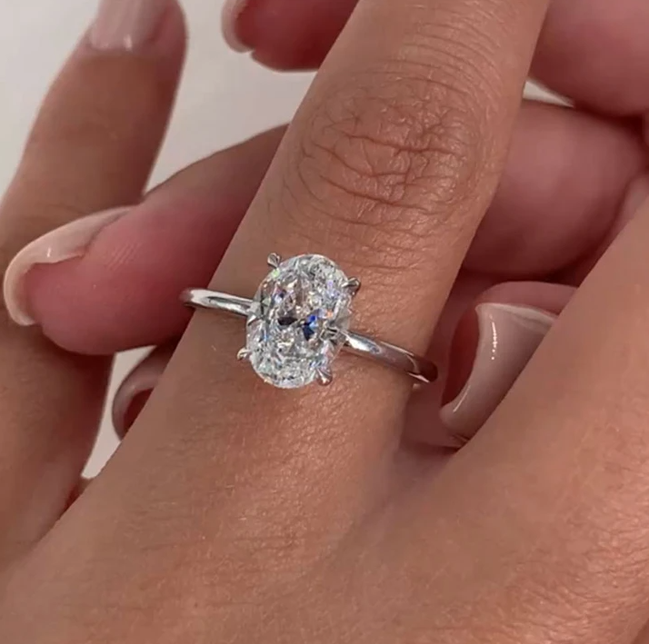 Oval Cut Solitaire Ring In Sterling Silver shine of diamond