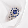 Sunflower Halo Round Cut Blue Sapphire Engagement Ring in Sterling Silver